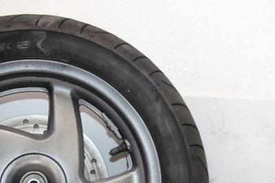 04-07 HONDA REFLEX SPORT 250 NSS250S OEM FRONT WHEEL RIM W TIRE