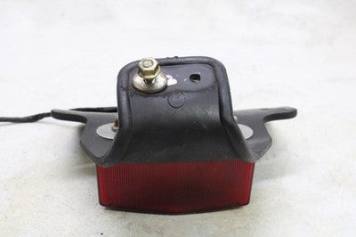 80-83 YAMAHA XT250 OEM REAR BACK TAIL LIGHT W MOUNT BRACKET