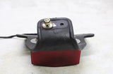 80-83 YAMAHA XT250 OEM REAR BACK TAIL LIGHT W MOUNT BRACKET